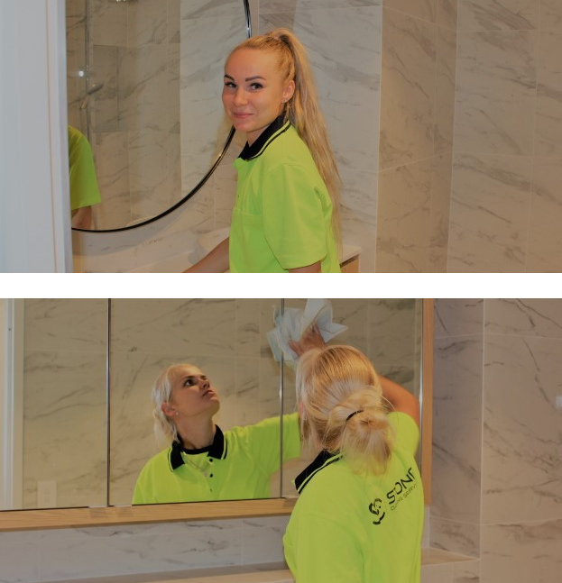 Ladies cleaning mirrors for Stone Cleaning Services